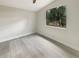 Bedroom featuring new flooring, paint, and a large window at 2117 W Paris St, Tampa, FL 33604