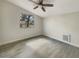 Clean bedroom featuring stylish floors and a large window, offering a bright and airy atmosphere at 2117 W Paris St, Tampa, FL 33604