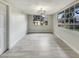 Dining room featuring new flooring, paint, and a modern light fixture at 2117 W Paris St, Tampa, FL 33604