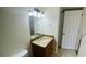 Bathroom vanity with granite countertop, updated faucet, and modern lighting fixture at 2850 Somerset Park Dr # 201, Tampa, FL 33613