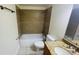 Bathroom featuring a tub-shower combo with tile surround and granite vanity at 2850 Somerset Park Dr # 201, Tampa, FL 33613