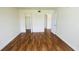 Spacious bedroom showcasing wood floors and a large walk-in closet for optimal storage at 2850 Somerset Park Dr # 201, Tampa, FL 33613