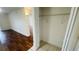 Bedroom closet with shelf and rod, tile floor, and view into a brightly lit room at 2850 Somerset Park Dr # 201, Tampa, FL 33613