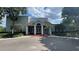 Community clubhouse featuring an appealing facade with covered entrance, columns and meticulous landscaping at 2850 Somerset Park Dr # 201, Tampa, FL 33613