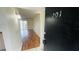 Condominium entryway leads into a brightly lit living area with wood-look flooring at 2850 Somerset Park Dr # 201, Tampa, FL 33613