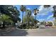 Beautiful landscaping and mature palm trees accent the well-maintained community exterior at 2850 Somerset Park Dr # 201, Tampa, FL 33613