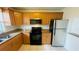 Kitchen featuring stainless steel appliances, granite counters and classic wood cabinetry at 2850 Somerset Park Dr # 201, Tampa, FL 33613