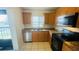 Well-lit kitchen featuring granite countertops, stainless steel appliances and ample cabinet space at 2850 Somerset Park Dr # 201, Tampa, FL 33613