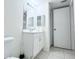 Bright bathroom featuring a vanity with white cabinetry and modern lighting fixtures at 2856 Somerset Park Dr # 102, Tampa, FL 33613