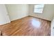 Bright bedroom with laminate floors and a window bringing in natural light at 2856 Somerset Park Dr # 102, Tampa, FL 33613