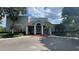 Community center with a red brick roof, white pillars, and well-maintained landscaping at 2856 Somerset Park Dr # 102, Tampa, FL 33613