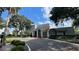 Community center with a red brick roof, white pillars, and well-maintained landscaping at 2856 Somerset Park Dr # 102, Tampa, FL 33613