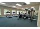 View of the gym featuring treadmills, exercise bikes, weights, and a mirrored wall at 2856 Somerset Park Dr # 102, Tampa, FL 33613