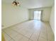 Bright living room with tile floors and sliding glass doors to outdoor area at 2856 Somerset Park Dr # 102, Tampa, FL 33613