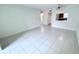 Open living room with tile floors offering views of the kitchen and bathroom at 2856 Somerset Park Dr # 102, Tampa, FL 33613