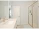 Clean bathroom design with a walk-in shower featuring white tile and a sleek glass door at 363 Surfside Ne Ave, St Petersburg, FL 33716