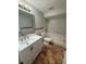 Bathroom with a vanity, a mosaic detail and a tub shower combination at 4325 Newbury Dr, New Port Richey, FL 34652