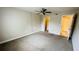 Bedroom featuring neutral walls, carpet flooring, and a ceiling fan at 2860 Somerset Park Dr # 203, Tampa, FL 33613