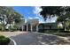 View of the community center's exterior with mature trees at 2860 Somerset Park Dr # 203, Tampa, FL 33613