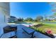 Backyard view of a fenced in private pool, patio and beautiful landscaping on a sunny day at 408 43Rd Street W Blvd, Palmetto, FL 34221