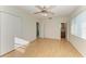 Spacious bedroom with laminate wood flooring, closet and a ceiling fan at 408 43Rd Street W Blvd, Palmetto, FL 34221