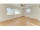 Bright bedroom with laminate wood flooring, a ceiling fan, and plenty of natural light from a large window at 408 43Rd Street W Blvd, Palmetto, FL 34221