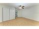 Bedroom with spacious closet, modern ceiling fan and wood-look floors at 408 43Rd Street W Blvd, Palmetto, FL 34221