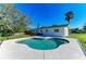 Backyard showing a large in-ground pool and exterior view of the home on a sunny day at 408 43Rd Street W Blvd, Palmetto, FL 34221