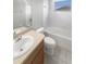 Bright bathroom features a large vanity, toilet and tub/shower combination at 12549 Chenwood Ave, Hudson, FL 34669