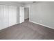 Neutral bedroom features plush carpet, base trim, an entrance doorway, and a double closet at 12549 Chenwood Ave, Hudson, FL 34669