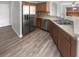 Modern kitchen with stainless steel appliances, countertops and wood cabinetry at 12549 Chenwood Ave, Hudson, FL 34669