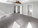 Spacious primary bedroom featuring new carpet and paint, with ensuite bathroom and ample natural light at 12549 Chenwood Ave, Hudson, FL 34669