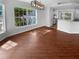 Bright dining room with a large window and beautiful wood floors at 8103 Rhanbuoy Rd, Spring Hill, FL 34606