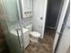 A functional bathroom offers a bright vanity, toilet, and shower, ready for everyday convenience at 4521 W Knox St, Tampa, FL 33614