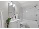 Bright bathroom features a stylish vanity, tub, and shower with clean white marble at 6612 27Th N Way, St Petersburg, FL 33702