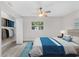 Comfortable main bedroom with a ceiling fan, closet and an exterior view at 1906 E Ida St, Tampa, FL 33610