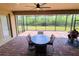 Spacious screened patio with brick pavers and outdoor seating at 20590 Granlago Dr, Venice, FL 34293