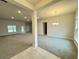 Open and bright living room with neutral carpeting and recessed lighting at 13009 Parade Ave, Weeki Wachee, FL 34614