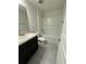 Bathroom with single vanity, tub shower combo, and tile flooring at 13106 Nusser Ave, Weeki Wachee, FL 34614
