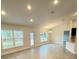Open concept dining room with tile floors and vaulted ceilings at 13106 Nusser Ave, Weeki Wachee, FL 34614
