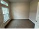 Spacious bedroom with large window and neutral carpeting at 5356 Frost Rd, Spring Hill, FL 34606