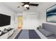 Comfortable bedroom with a double bed and large TV at 19617 Sunset Bay Dr, Land O Lakes, FL 34638