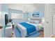 Serene bedroom featuring a comfy bed, light blue walls, and a chandelier at 19617 Sunset Bay Dr, Land O Lakes, FL 34638
