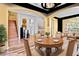 Spacious dining area with hardwood floors and access to living room and stairs at 19617 Sunset Bay Dr, Land O Lakes, FL 34638