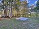 Spacious backyard with a concrete pad, perfect for outdoor activities at 8531 Bass Lake Dr, New Port Richey, FL 34654
