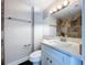 Updated bathroom features a vanity with quartz countertop and designer tile at 8531 Bass Lake Dr, New Port Richey, FL 34654