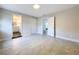 Spacious bedroom with light walls and tile floors; includes access to a bathroom at 8531 Bass Lake Dr, New Port Richey, FL 34654