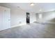 Versatile bonus room with tile flooring and access to an exterior door at 8531 Bass Lake Dr, New Port Richey, FL 34654