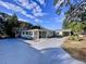 Updated home with paved driveway and attractive landscaping at 8531 Bass Lake Dr, New Port Richey, FL 34654