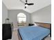 Bright bedroom with a double bed, dresser, and a large window at 1228 Cord Grass Ct, Wesley Chapel, FL 33543